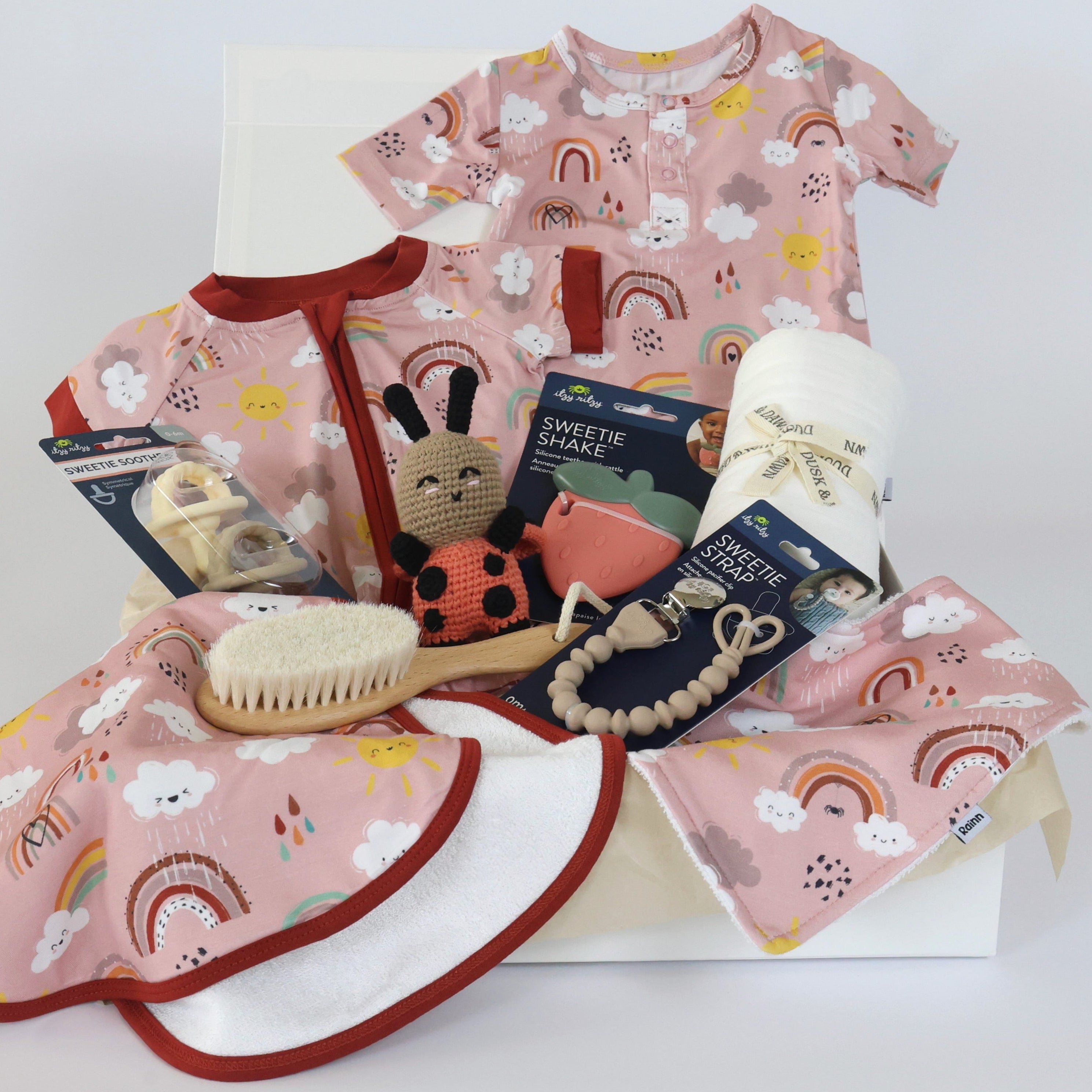 Baby Gift Set For Girls Play All Day Rainnbow with bamboo babywear, essentials, toys in pink rainbow design. Perfect for showers and birthdays.