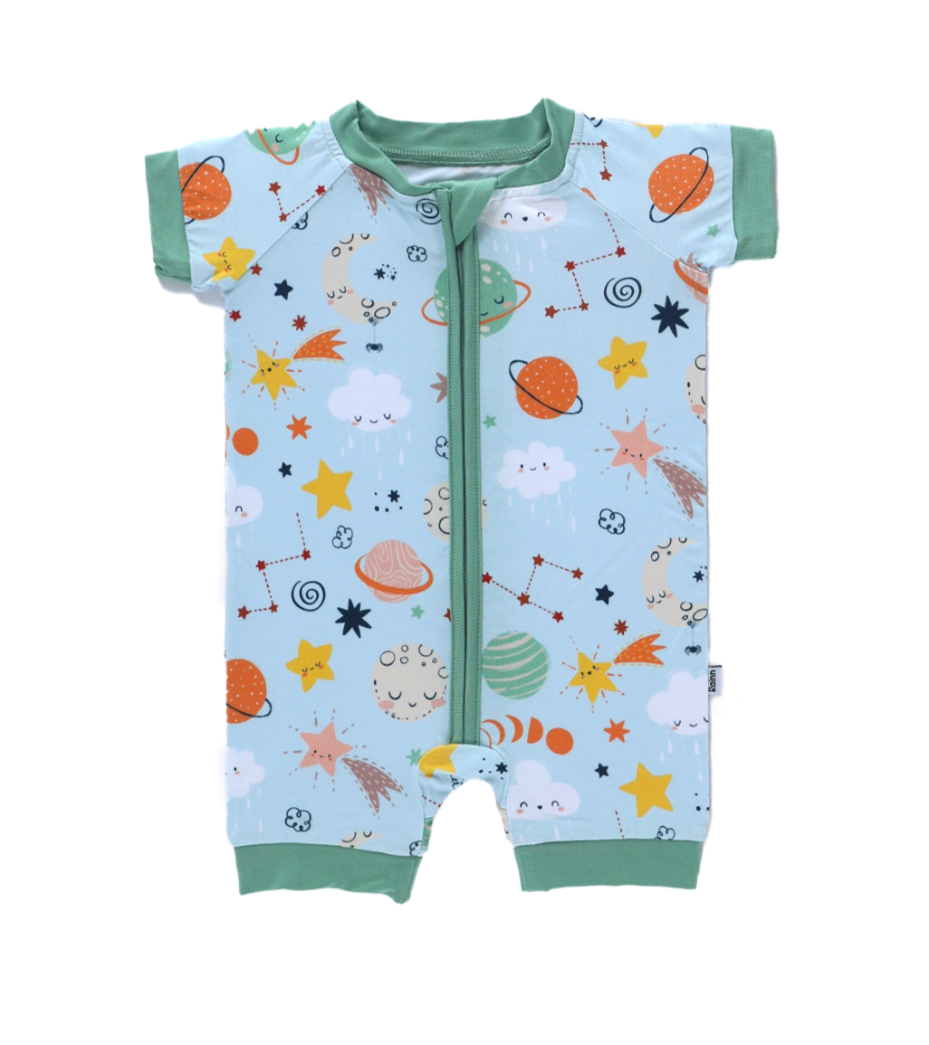 Cosmic Short Zipp Romper by Rainn, featuring playful space prints on soft bamboo fabric.