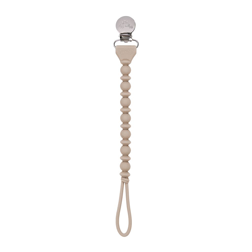 Sweetie Strap™ silicone pacifier clip in beige, featuring stylish beads and a secure clasp for babies.