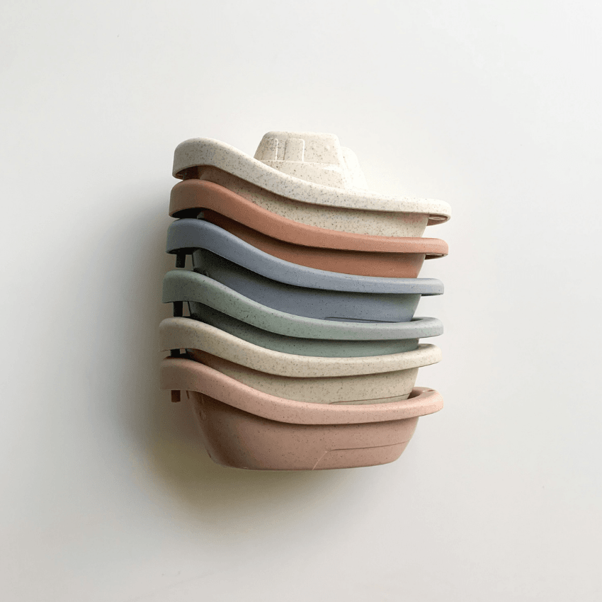 Eco-friendly wheat straw boat set by Bug + Bean Kids, stackable and colorful for sustainable bath and pool time fun.