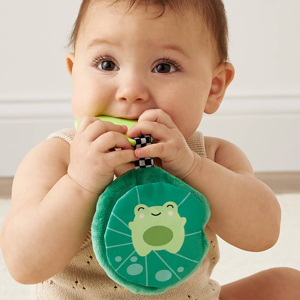 Baby enjoying the Itzy Frog Sweetie Crinkle™ teether, featuring soft plush and soothing silicone design.