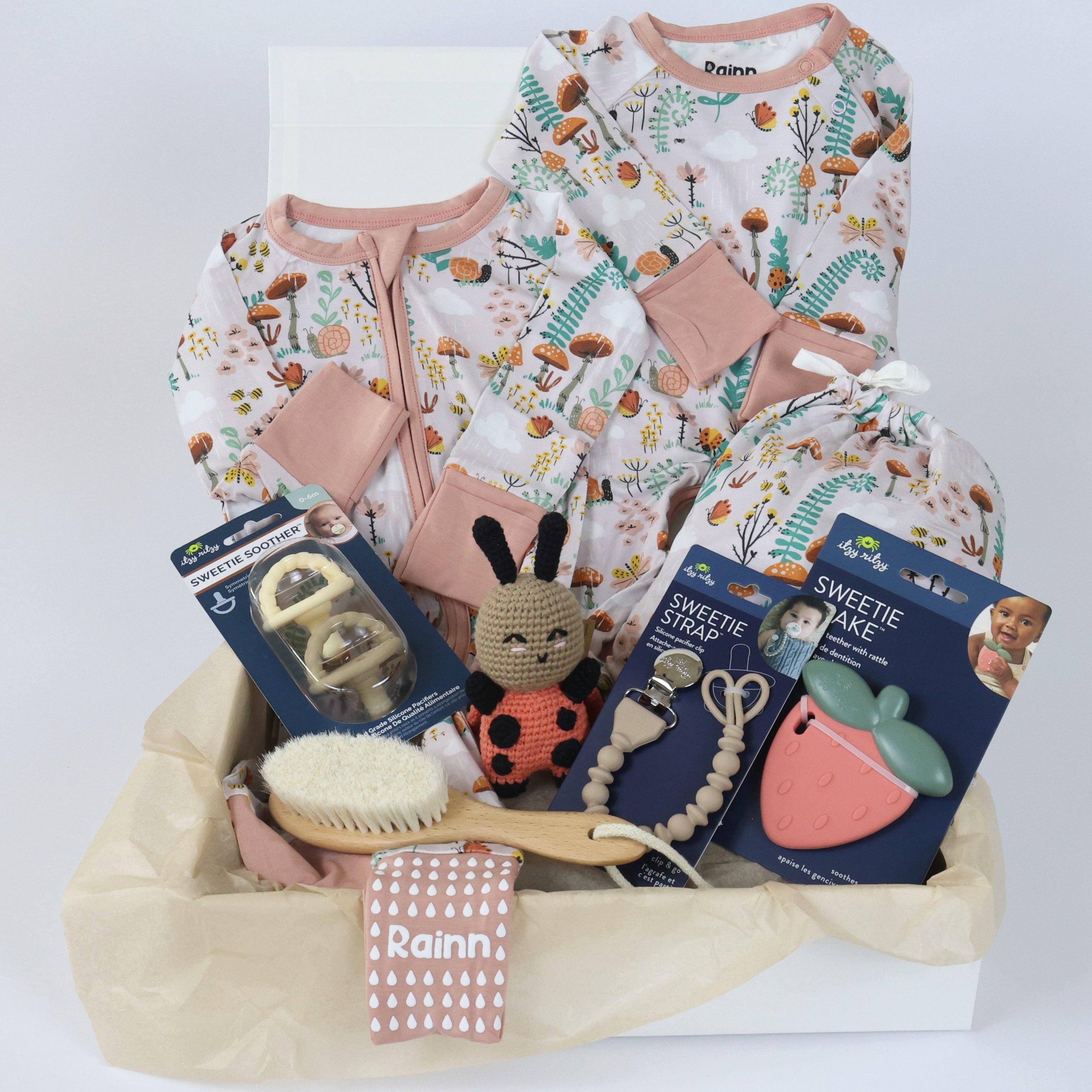 Baby Gift Set for Girls with Sleep and Play essentials in soft bamboo fabric featuring outfits, toys, and accessories for comfort.