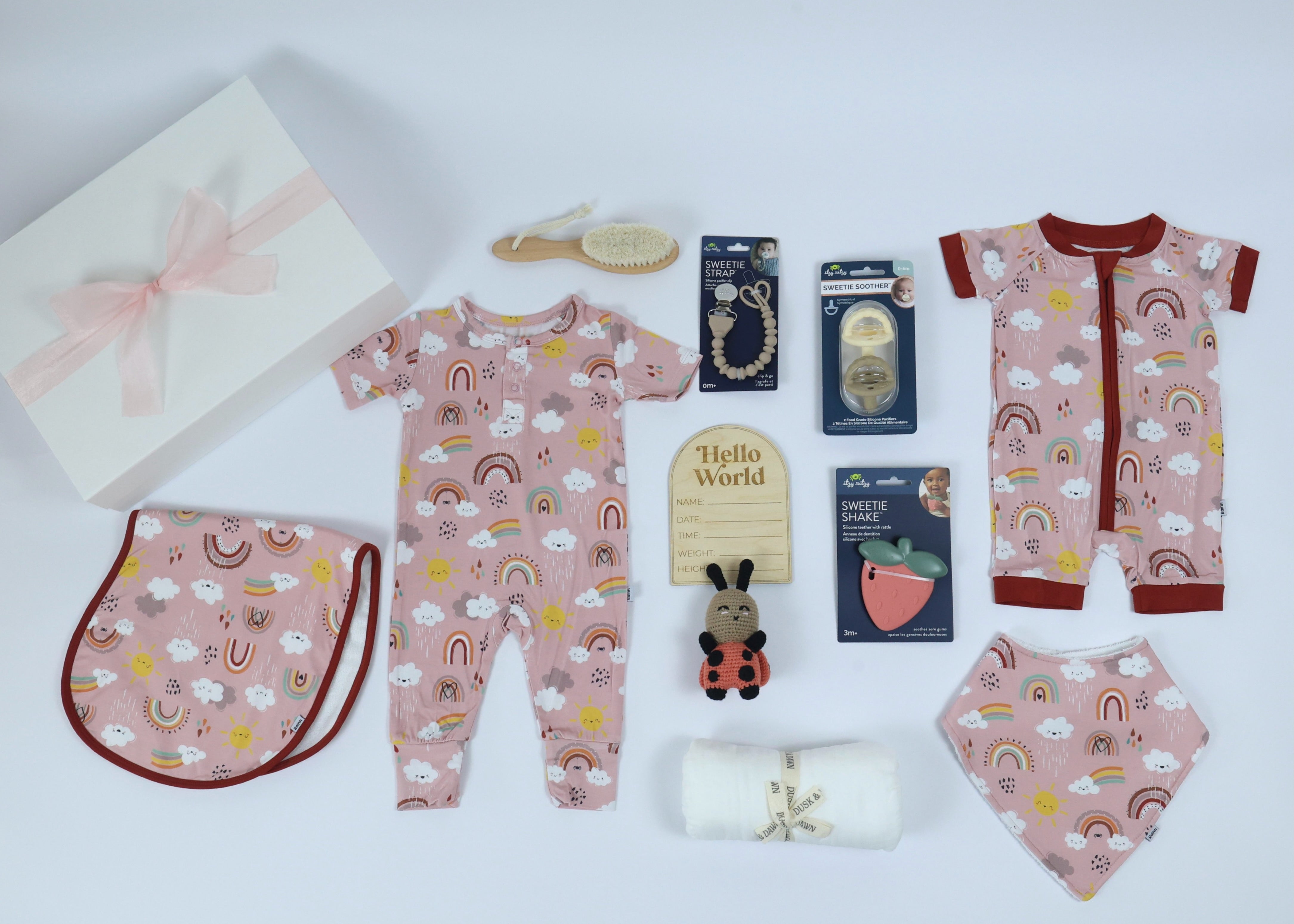 Baby Gift Set for Girls by Rainnbow featuring bamboo babywear, toys, and essentials for cozy and practical moments.