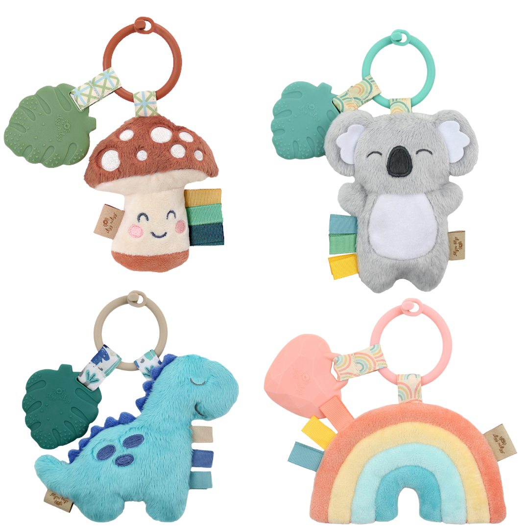 Colorful Itzy Pal plush toys with silicone teethers, featuring a rainbow, koala, dino, and mushroom for babies 0m+.