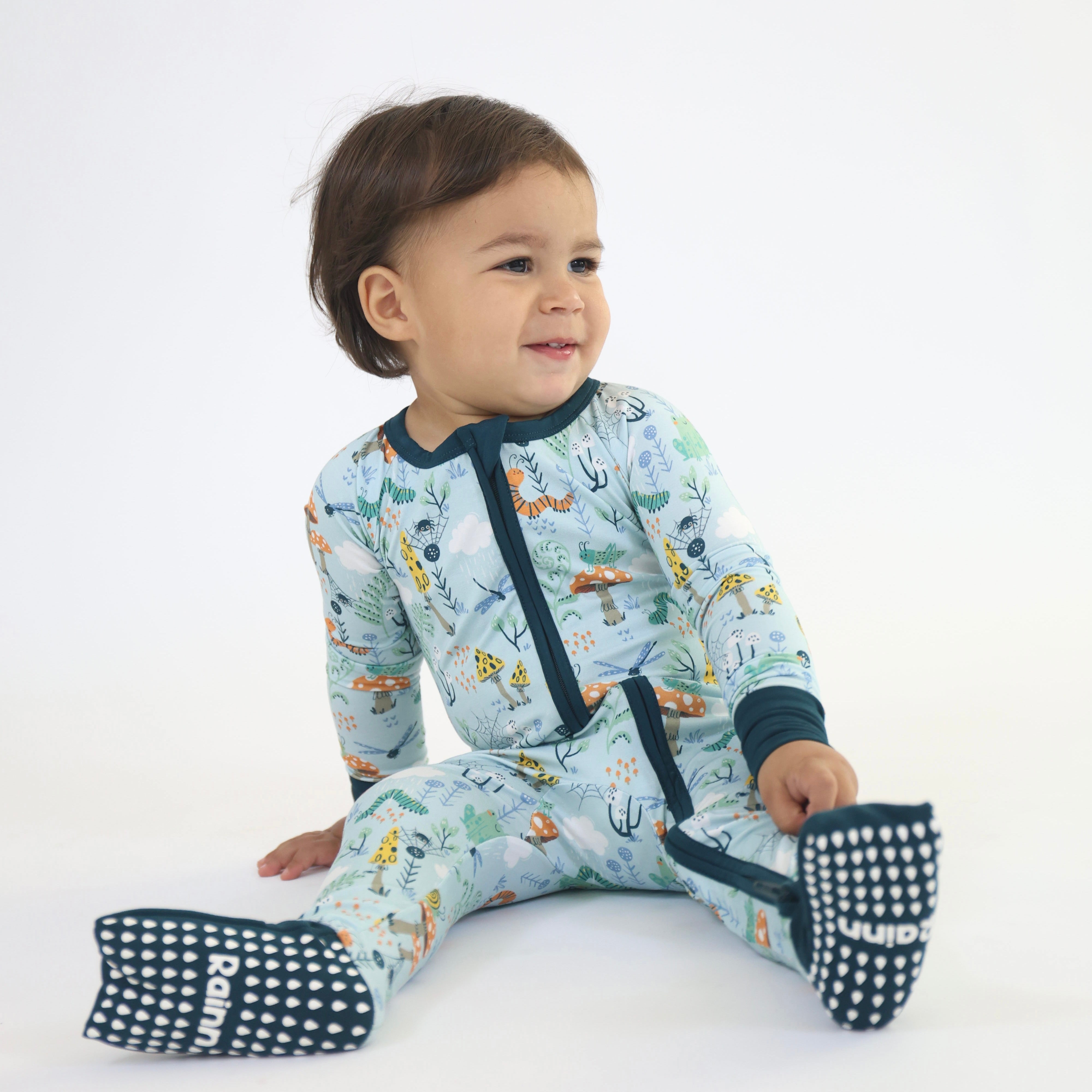 Toddler wearing Bamboo Zipp Jammies - Critter Hollow by Rainn, featuring breathable, hypoallergenic fabric for cozy sleep.