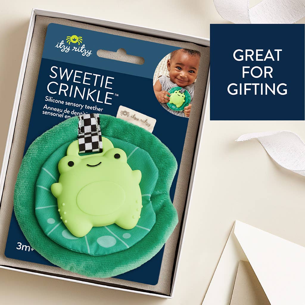 Itzy Teether Frog Sweetie Crinkle™, a fun silicone teether with plush and crinkle sounds, perfect for sensory play.